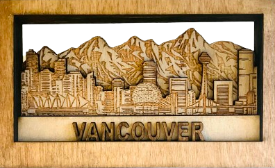 Wooden wall art of Vancouver with mountains and cityscape